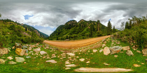 Full 360 degree spherical HDRi panorama of a mountain gorge with dry dirt road, rocks and...