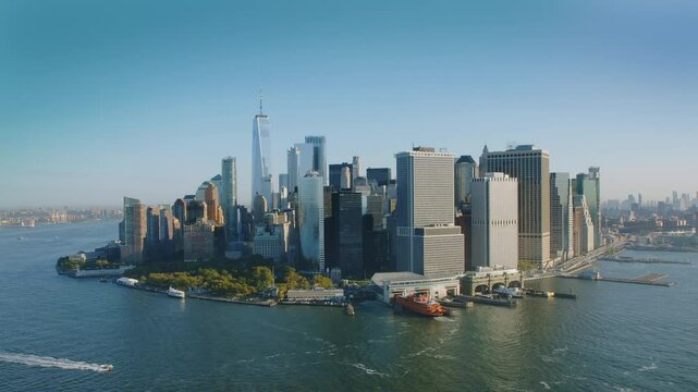 Aerial view of The Financial District in Lower Manhattan. Cityscape, piers and famous skyscrapers of New York City. Shot from a helicopter.