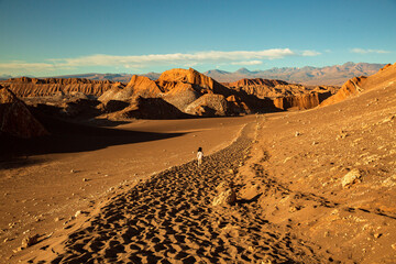 Girl running in Valle de la Luna, Chile
