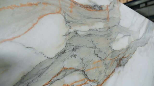 Colorful quartz and porcelain tile stone slab are standing in the factory warehouse. Kitchens and bathrooms countertop selection. Granite slabs are prepared for sale in store yard