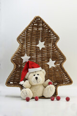 Christmas card with teddy bear and Christmas decorations