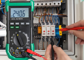 Digital Multimeter Measuring Voltage in Electrical Circuit
