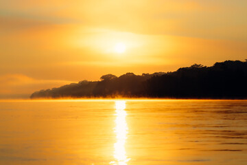 Yellow Sunrise on Madre de Dios, Peru