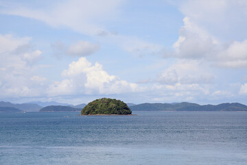 Island on the sea against the backdrop of the sea and hills