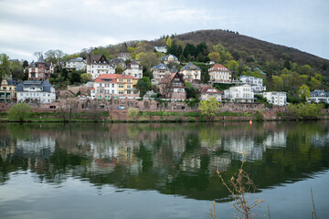 Fototapeta premium Heidelberg, Germany - 31.03.2024 - View of Beautiful Heidelberg, Hill Reflection in Neckar River, Easter 2024