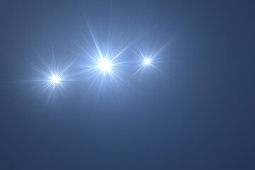 Obraz premium Subtle glowing starbursts on a gradient navy-blue background