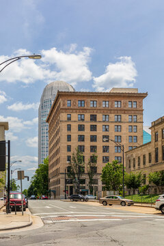 WINSTON-SALEM, NC, USA-1 JUNE 2021: In the foreground is the old Wachovia building, with the towering 1995 Wachovia skyscraper behind, later to become the Wells Fargo Center. Vertical view.