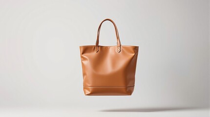 Elegant brown leather tote bag on minimal background