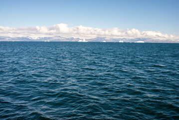 Open Ocean Waters of Disko Bay: Icebergs and Disko Island in the Distance