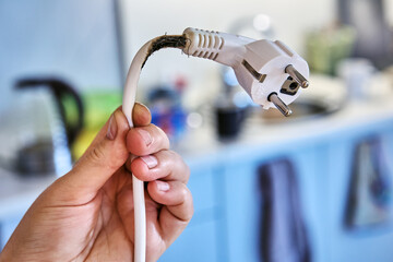 Extension cord burned out when overloaded by powerful electrical appliance.