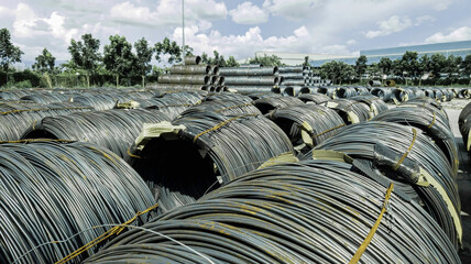 Fototapeta premium Stacked of high carbon wire rod for heavy industry production,Pile of metal steel wire roll for construction site, concrete usage and building construction