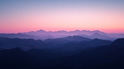 Serene sunset over majestic mountain range.