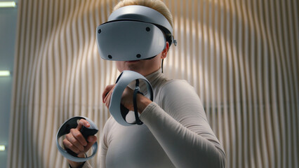 Cyber sport boxing Caucasian woman girl female gamer player VR helmet virtual augmented reality...