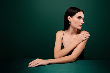 Fototapeta premium Photo of adorable lady dressed sexy outfit enjoying her beauty isolated green color background