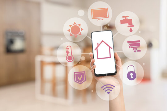 Blurred view of light kitchen with counters and dining table