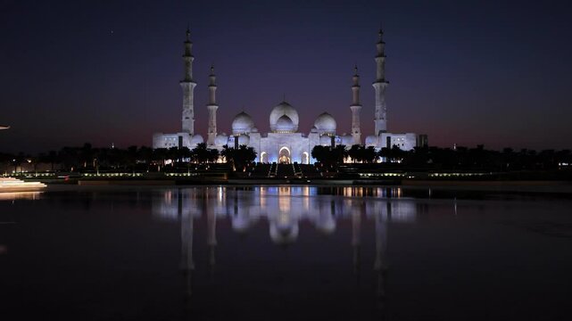 Sheikh Zayed Grand Mosque in Abu Dhabi at night as seen from Wahat Al Karama