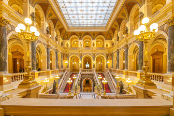 The grand staircase in Prague National Museum features stunning architecture, ornate decorations,...