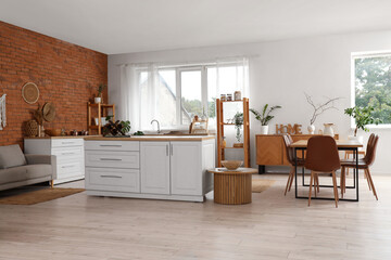 Interior of modern  kitchen with brick wall