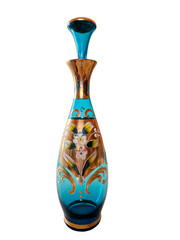 antique decanter bottle, vintage blue glass with floral motif and gold isolated on white
