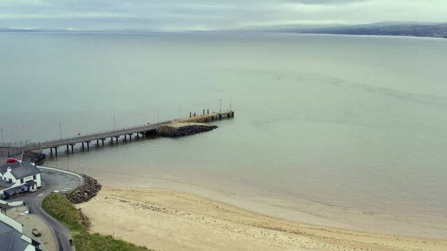 Aerial descend over Lough Foyle, highlighting Magilligan Ferry Port and Martello Tower
