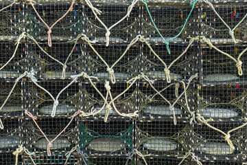 Lobster cages on a pier off the Rhode Island coast getting prepared to go on the fishing boat for the day.