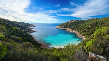 Breathtaking Coastal View of Crystal Clear Waters in a Lush Natural Landscape Surrounded by Rolling Hills and Vibrant Green Vegetation Under a Blue Sky