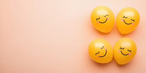Fototapeta premium Happy yellow balloons with smiley faces on pastel background