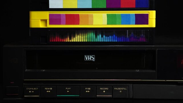 Inserting Video Cassette Tape With Family Vacation Recording In VRC and Pressing Play Button