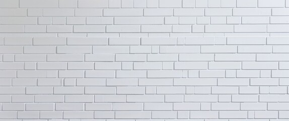  white brick wall. The wall consists of uniformly arranged rectangular bricks, each with a subtle texture that adds depth to the otherwise flat surface.