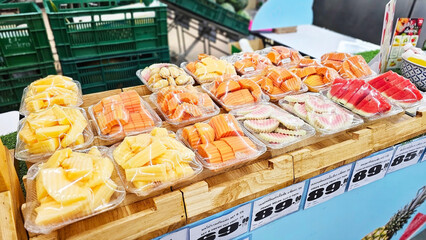 Fresh Cut Tropical Fruits Display at Thailand local market.  Thailand, November 19, 2024