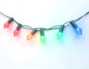 Colorful string of Christmas lights with red, green, and blue bulbs against a white background