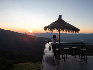 A seating area with a view of the evening sun.