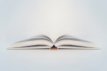 Fototapeta premium Open book of blank pages on blue background. copy space