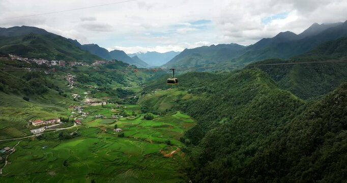 Sapa Fansipan gondola travels over scenic and verdant Muong Hoa Valley, aerial