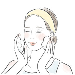 優しく泡で洗顔する若い女性