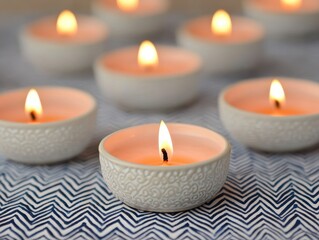 Festival of lights concept. Soft lit candles arranged on a decorative surface.