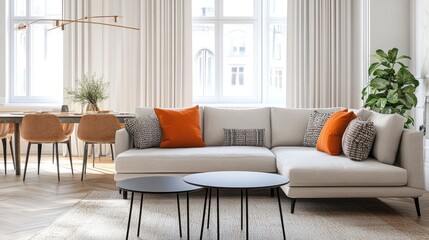 Stylish living room featuring a light gray sectional sofa with orange accents and a modern dining area.