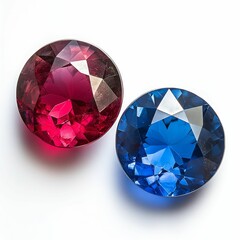 Fototapeta premium Two faceted gemstones: red and blue.
