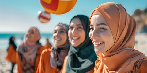 Obraz premium Smiling Women Playing Volleyball on Beach.