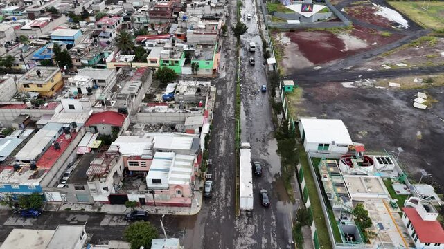 Drone footage of neglected streets with potholes in Ecatepec, Mexico