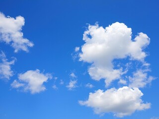 Obraz premium A bright blue sky with puffy white clouds on a sunny spring day, blue sky, outdoors, weather