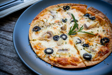 Homemade pizza with shiitake mushrooms