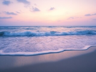 Fototapeta premium A serene beach at sunset with gentle waves lapping at the shore.