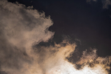 Fototapeta premium Dramatic cloudscape with fluffy cumulus clouds against a vibrant blue sky. This versatile image evokes feelings of freedom, peace, and possibility. 