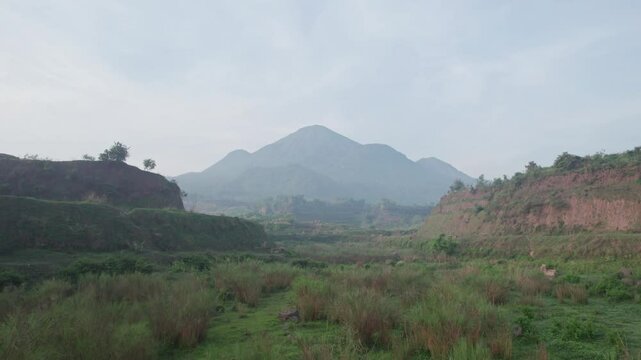 Aerial view of Ranu Manduro in East Java, Indonesia, captured by a professional on January 9, 2024. The video showcases the morning landscape of the savanna with a mountain in the background