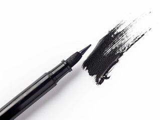 Fototapeta premium A close-up of a black marker with a nib, leaving a bold stroke on a white surface.