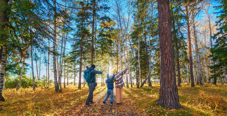 Family in beautiful autumn forest 