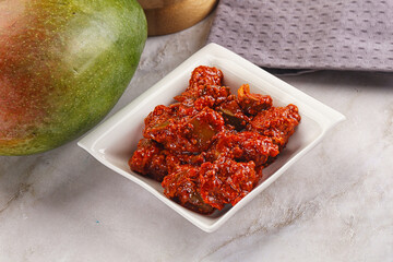 Spicy pickled raw green mango