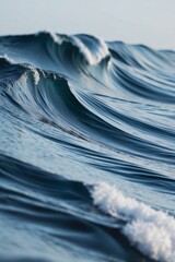 A series of blue waves are shown in a close up.