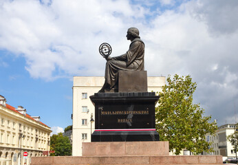Monument to Nicholas Copernicus (1830) by Bertel Thorvaldsen holding a compass and armillary sphere...